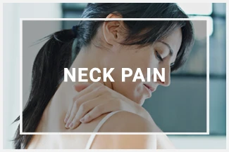 A woman holding her neck in pain, trying to massage out the pain